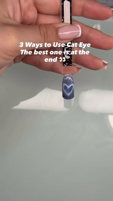 A blue cat-eye nail sample with a luminous magnetic heart, by Karina
